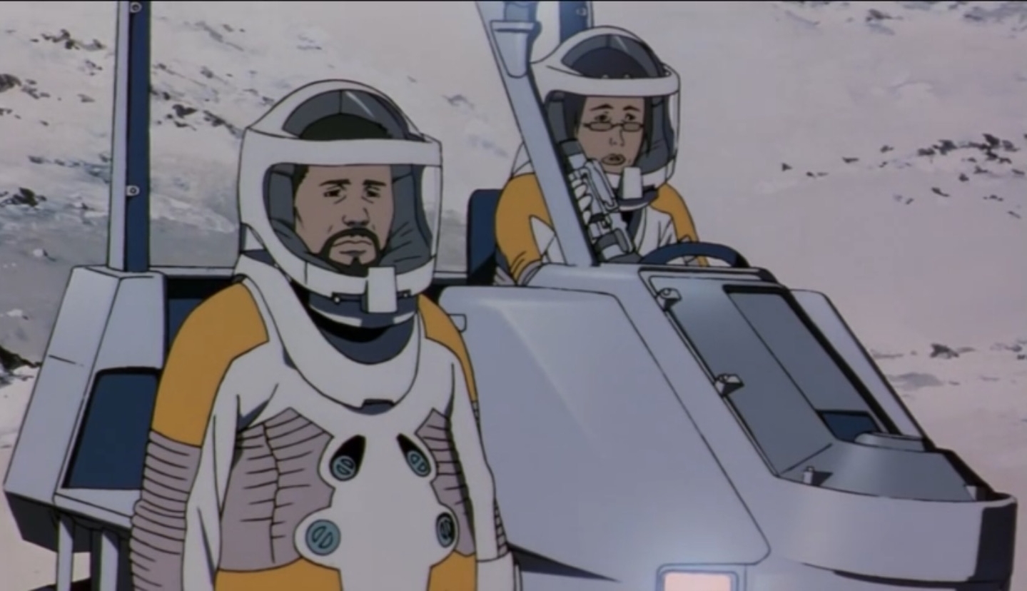 Genya in the memory of Chiyoko's final film, suited up in the space suit from the film looking sadly and chiyoko runs to find the easel with the painter missing, the moment of the film where Chiyoko confronts that she doesn't even remember what he looks like anymore